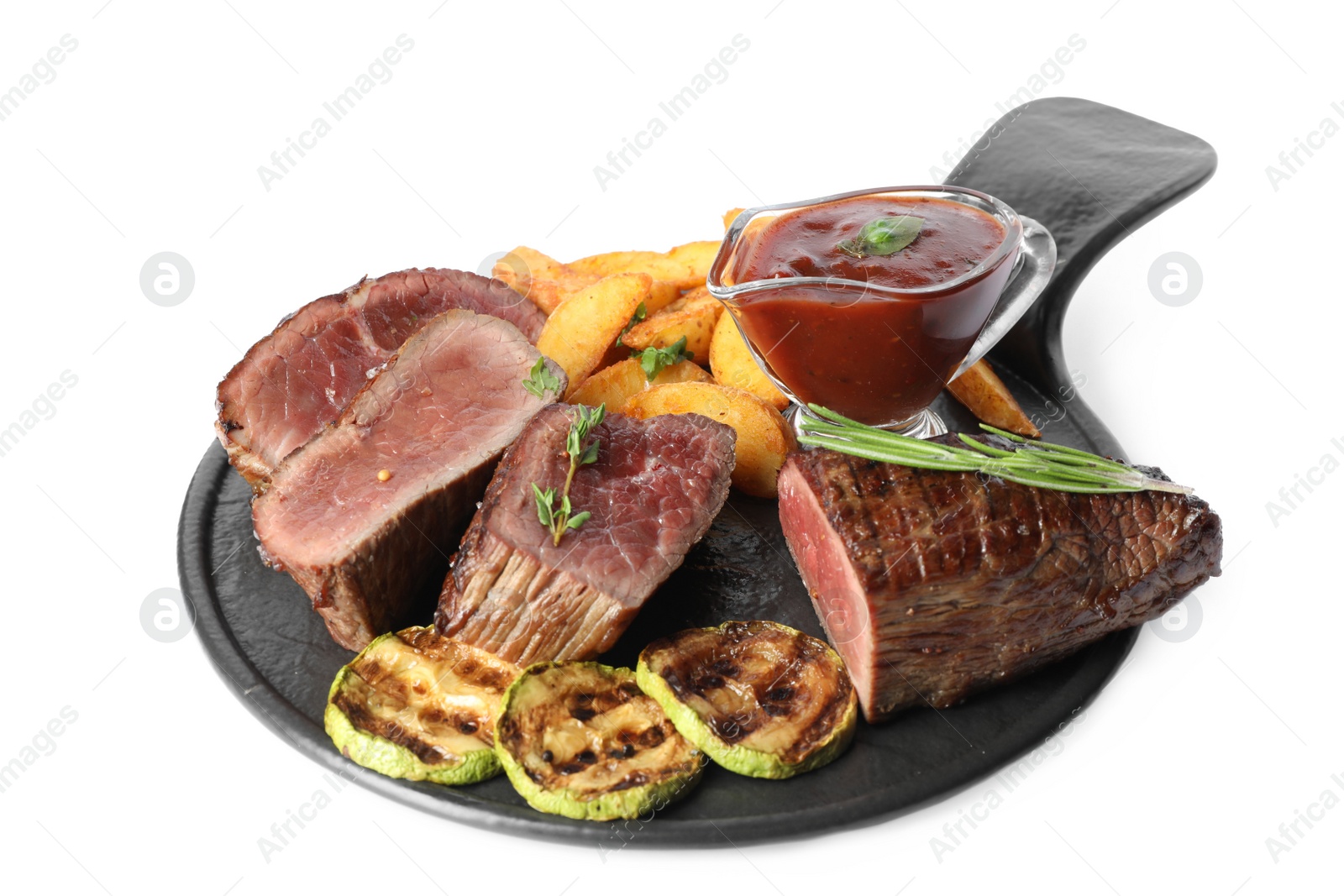 Photo of Delicious sliced beef tenderloin served with fried potatoes isolated on white