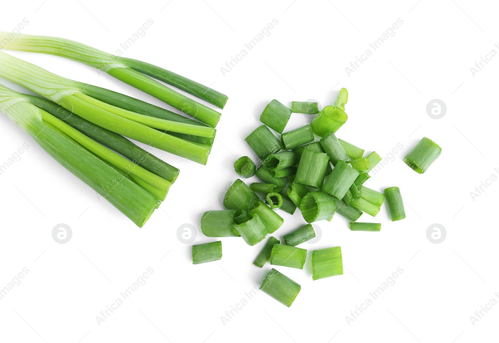 Photo of Cut green spring onions isolated on white, top view