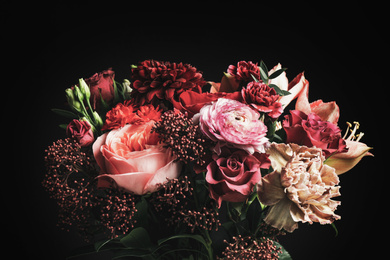 Photo of Beautiful bouquet of different flowers on black background. Floral card design with dark vintage effect