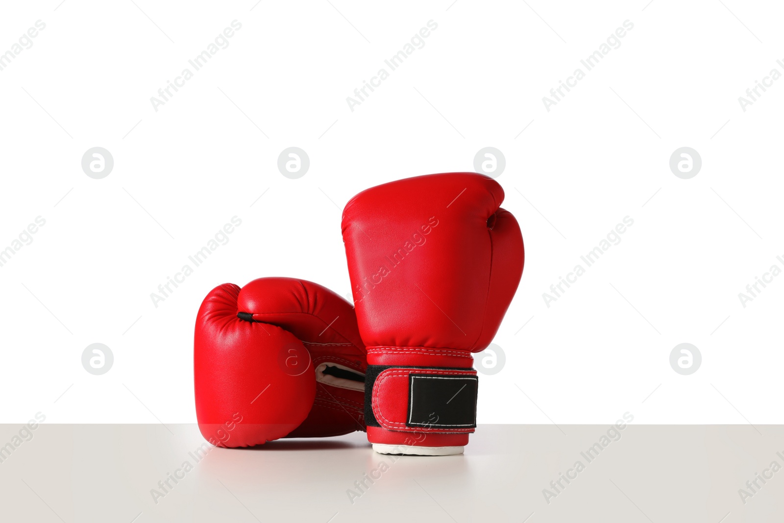 Photo of Pair of boxing gloves on white background