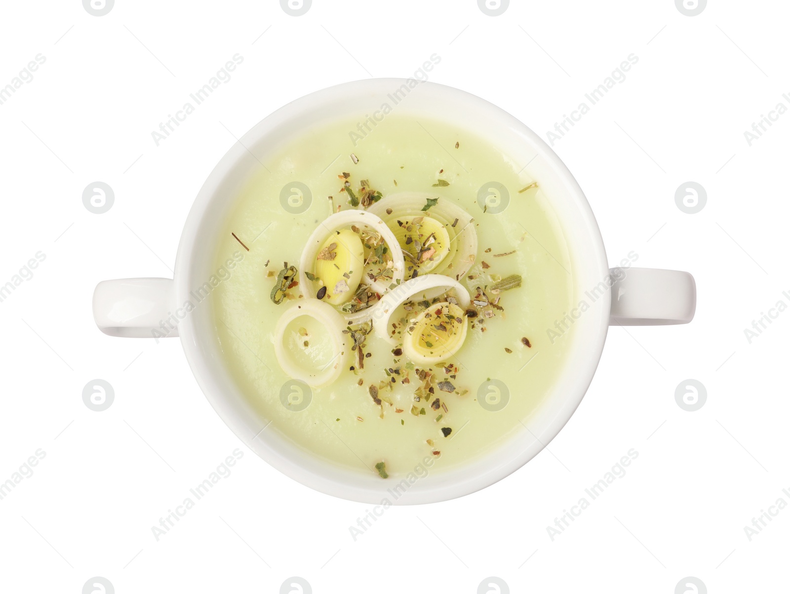 Photo of Delicious cream soup with leek and spices in bowl isolated on white, top view