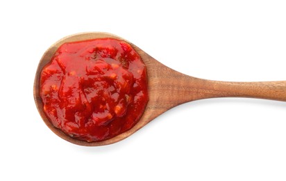 Delicious adjika sauce in wooden spoon isolated on white, top view