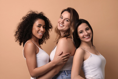 Photo of Group of women with different body types on beige background