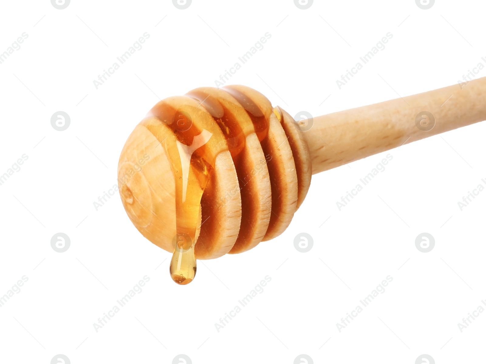 Photo of Honey dripping from dipper on white background