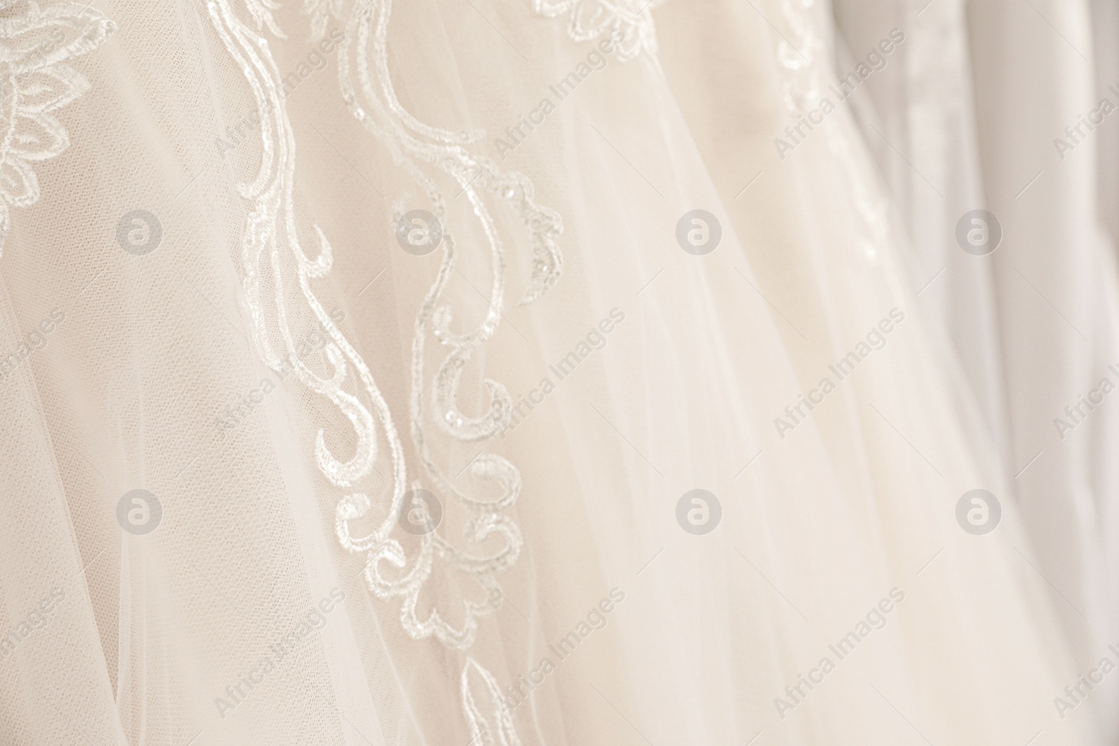 Photo of Beautiful wedding dress with lace, closeup view