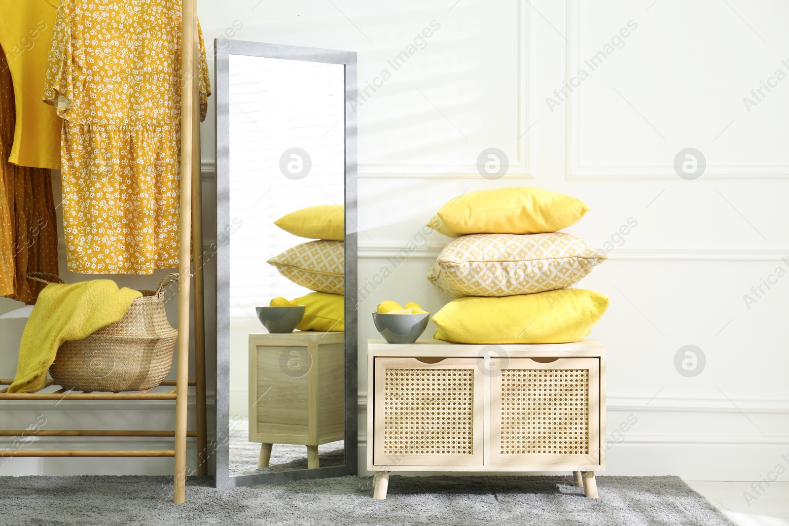 Photo of Stylish dressing room with big mirror. Interior design in grey and yellow colors