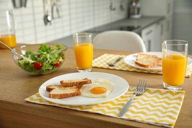 Tasty breakfast served on table in kitchen