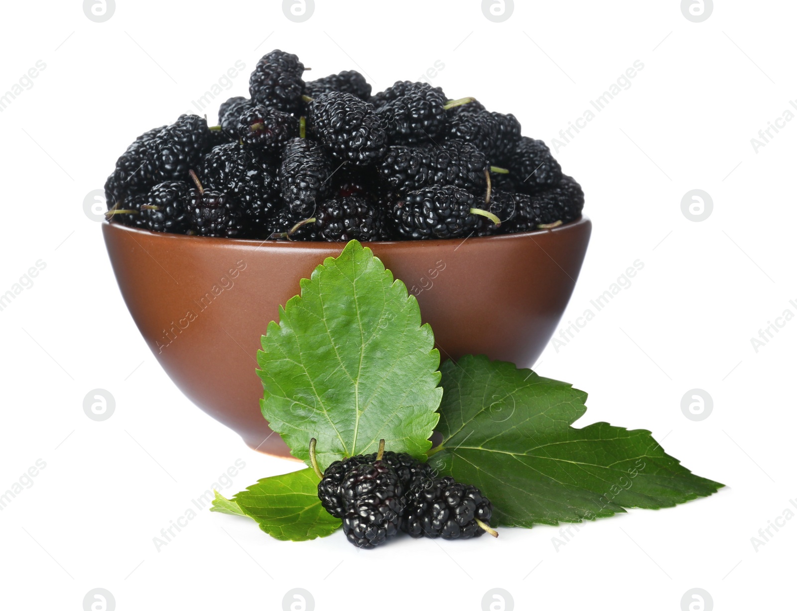 Photo of Ripe black mulberries and leaves on white background