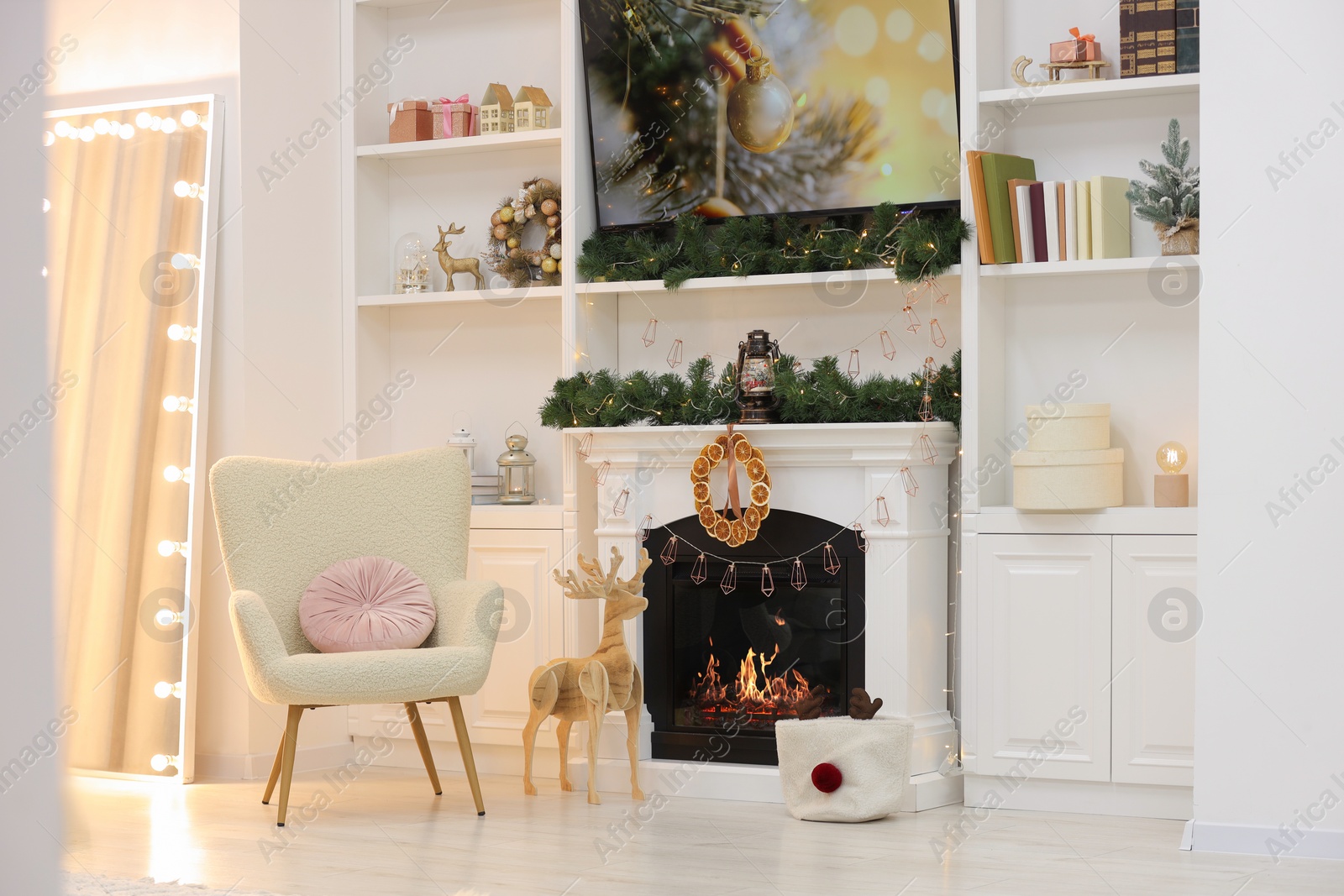 Photo of Living room with fireplace and Christmas decorations. Festive interior design