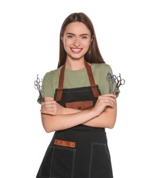 Portrait of happy hairdresser with professional scissors on white background