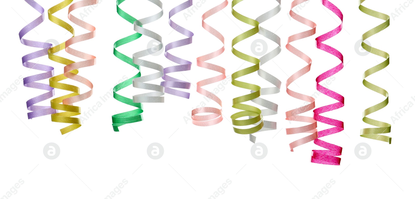 Photo of Many colorful serpentine streamers on white background