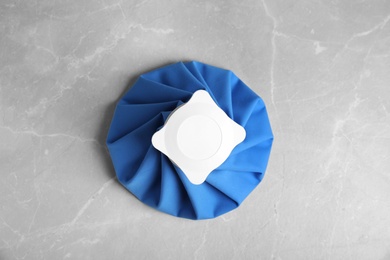 Ice pack on marble table, top view