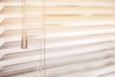 Photo of Closeup view of stylish horizontal window blinds