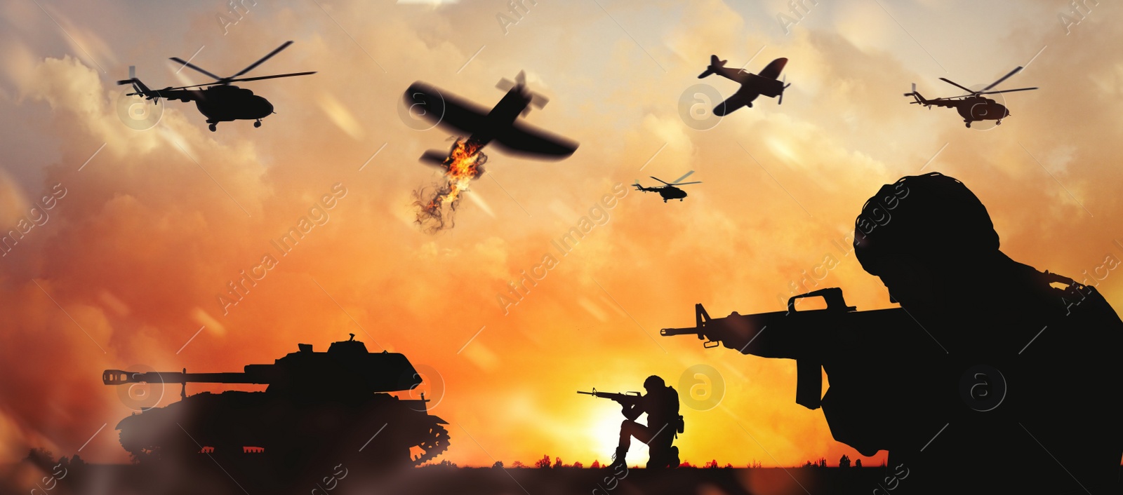 Image of Troops on battlefield at sunset. Military service
