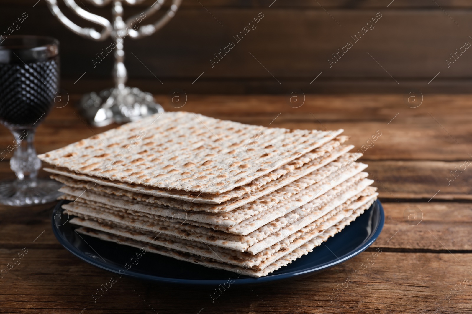 Photo of Stack of traditional matzos on wooden table