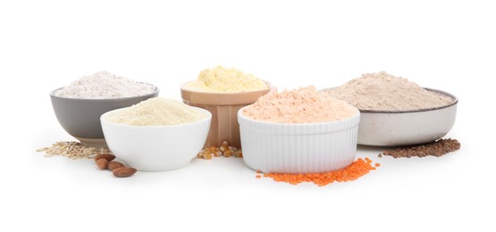 Photo of Different types of flour in bowls on white background