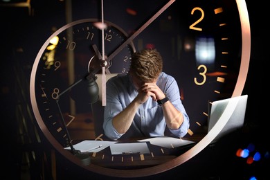 Image of Deadline management. Double exposure of man working in office at night and clock