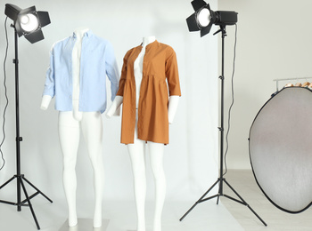 Ghost mannequins with modern clothes in professional photo studio