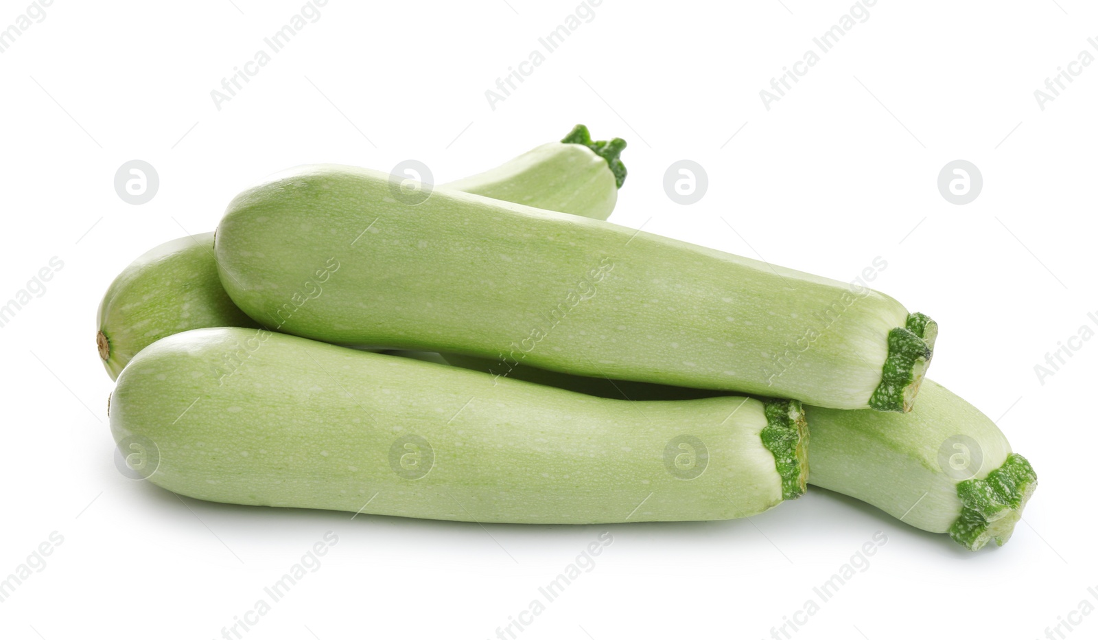 Photo of Fresh ripe green zucchinis isolated on white