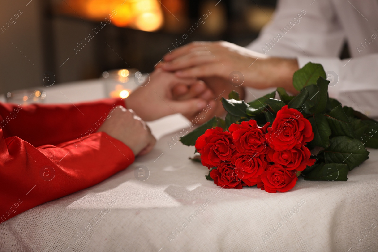 Photo of Couple having romantic dinner on Valentine's day in restaurant, closeup