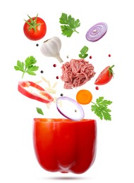 Image of Stuffed pepper recipe. Fresh ingredients falling into bell pepper on white background