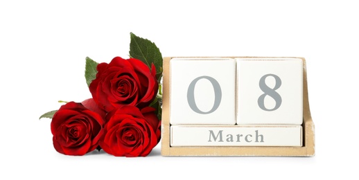 Wooden block calendar with date 8th of March and roses on white background. International Women's Day