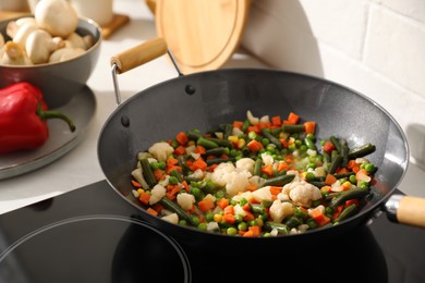Photo of Frying pan with mix of fresh vegetables, closeup