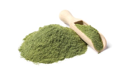Photo of Pile of wheat grass powder and scoop isolated on white