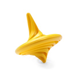 Photo of One yellow spinning top on white background