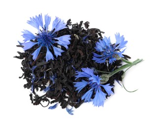 Dried cornflower tea and fresh flowers on white background, top view