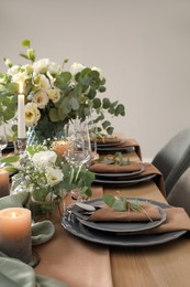 Festive table setting with beautiful floral decor indoors