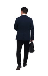 Photo of Businessman in suit with briefcase walking on white background, back view