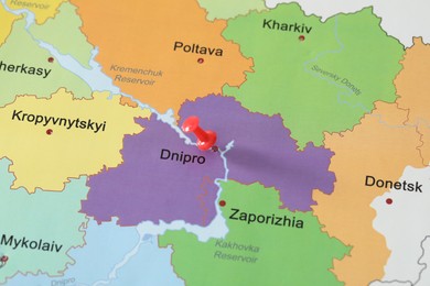 Photo of Map of Ukraine with red push pin placed on Dnipro, closeup