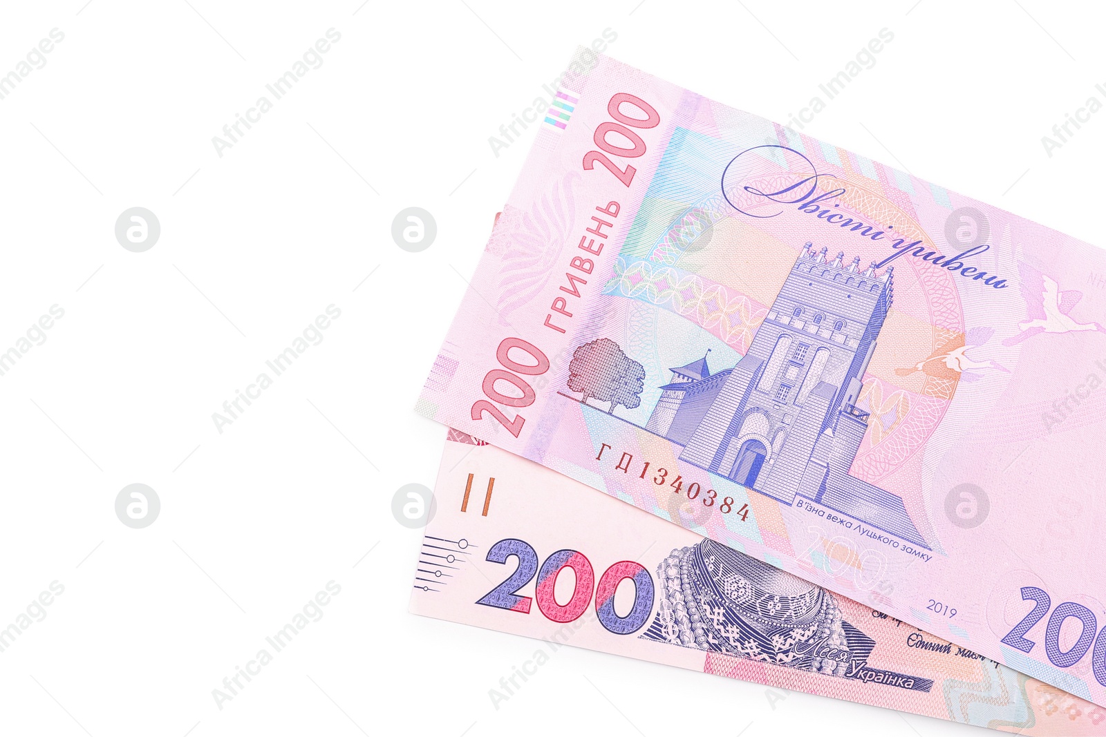 Photo of 200 Ukrainian Hryvnia banknotes on white background, top view