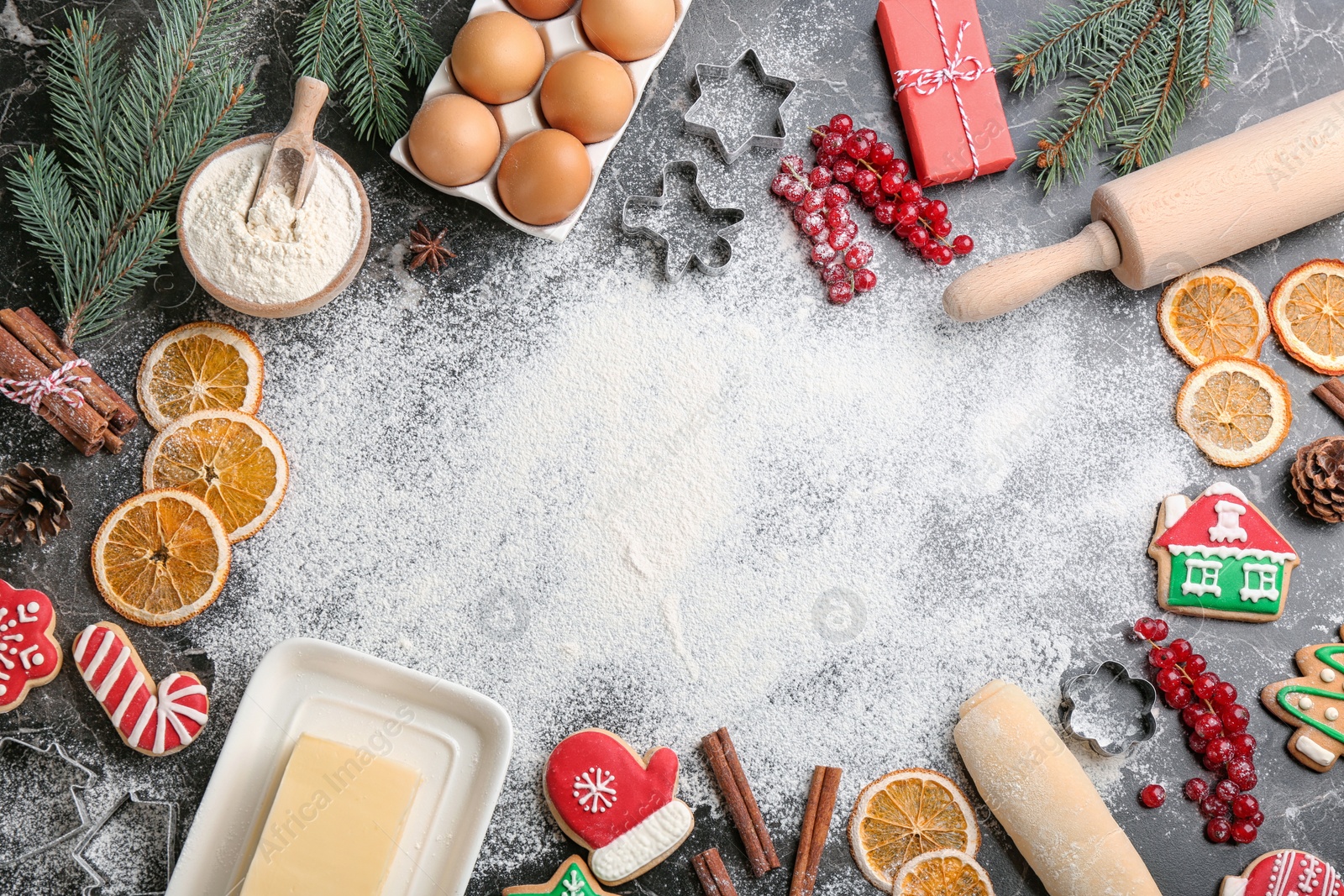 Photo of Flat lay composition with homemade Christmas cookies and ingredients on grey table, space for text