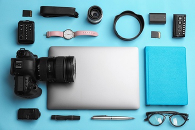 Flat lay composition with photographer's equipment and accessories on color background