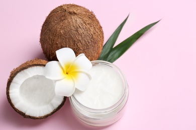 Photo of Beautiful composition with coconut oil and nuts on color background