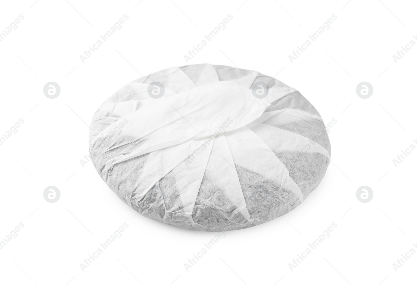 Photo of Disc shaped traditional Chinese pu-erh tea in paper wrap isolated on white