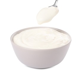 Photo of Ceramic bowl and spoon with delicious organic yogurt on white background