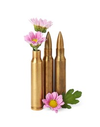 Bullets and beautiful flowers isolated on white