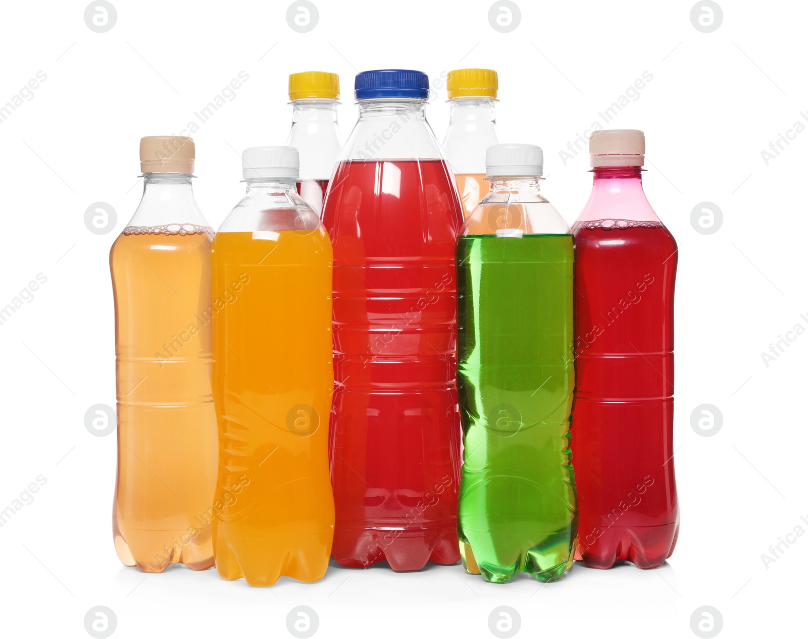 Photo of Bottles of soft drinks on white background