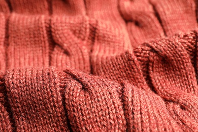 Brown knitted sweater as background, closeup view