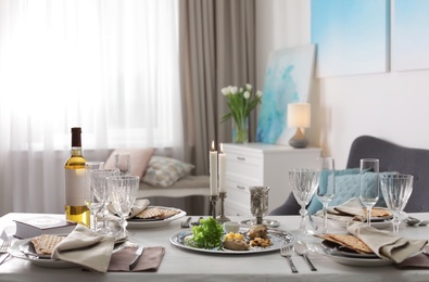 Photo of Festive Passover table setting at home. Pesach celebration