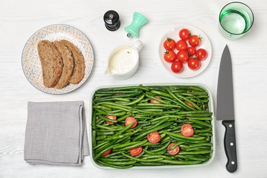 Photo of Flat lay composition with tasty green beans on table