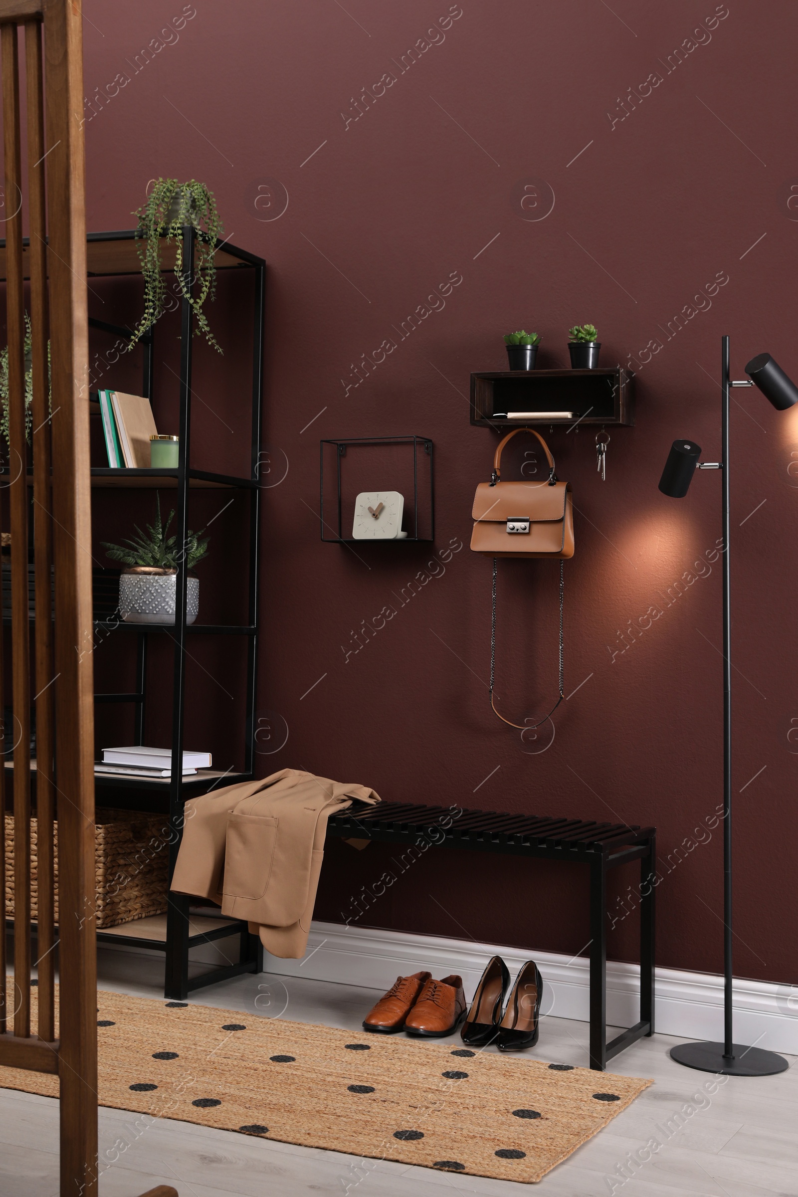 Photo of Modern hallway interior with stylish furniture and key holder