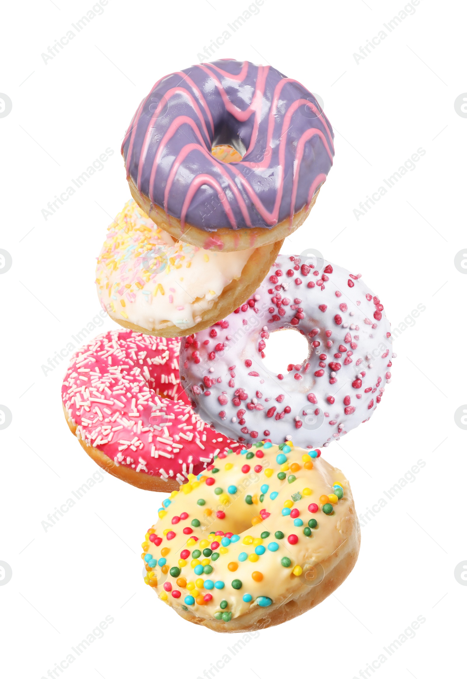 Image of Set of falling delicious donuts on white background