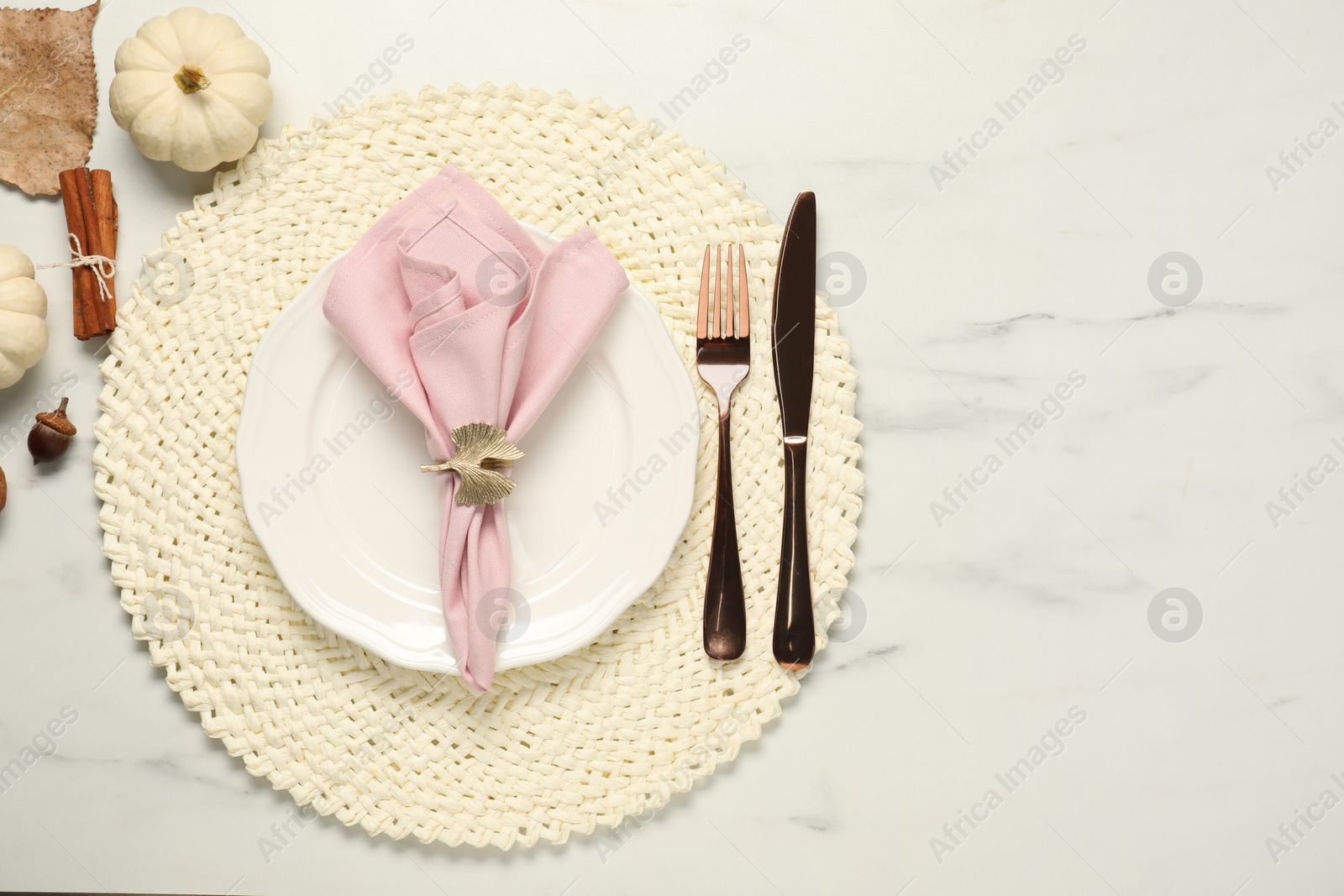 Stylish autumn table setting on white marble background, flat lay. Space for text Photo of Stylish autumn table setting on white marble background, flat lay. Space for text
