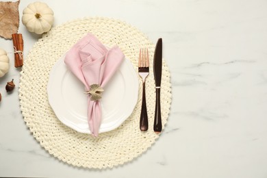 Photo of Stylish autumn table setting on white marble background, flat lay. Space for text