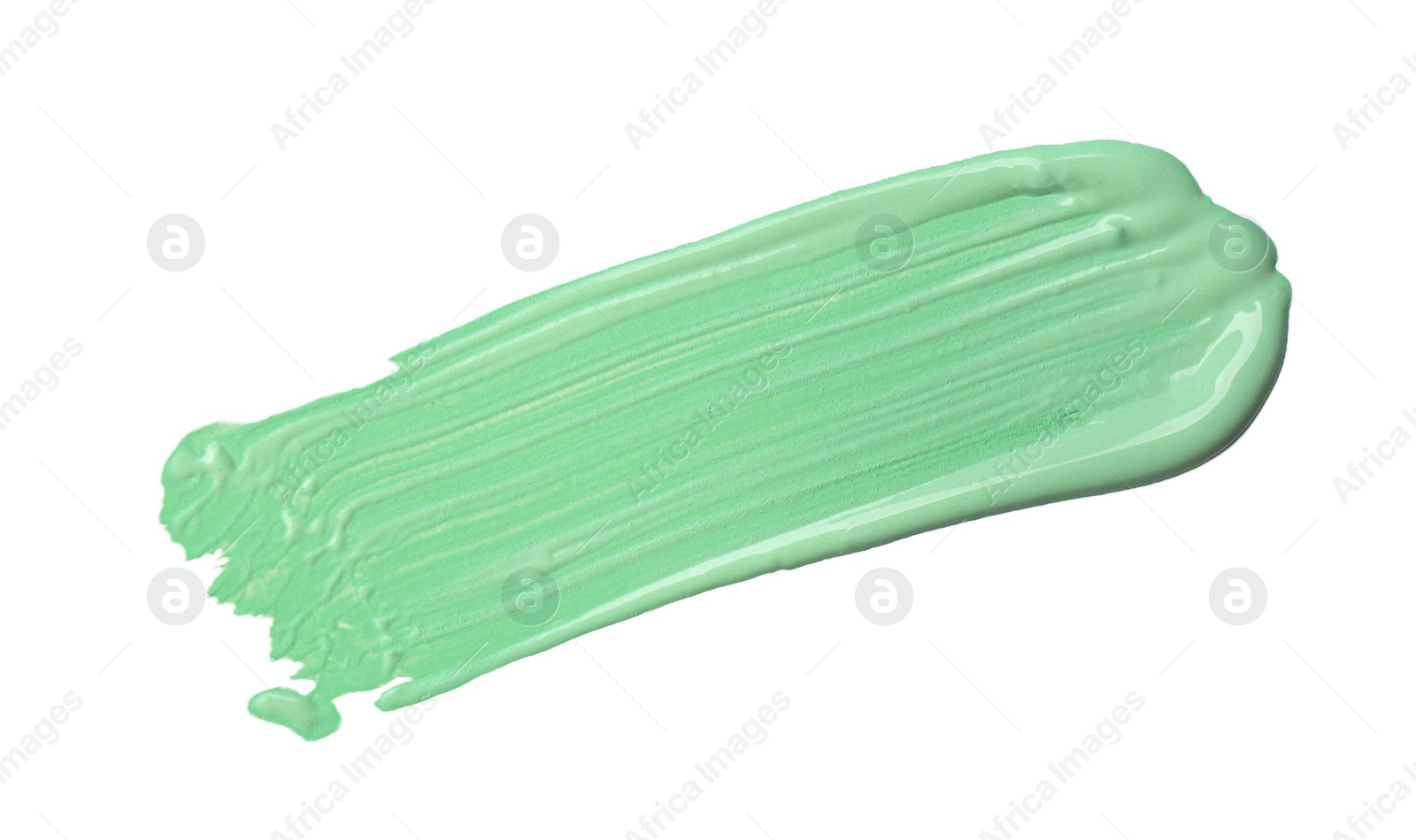 Photo of Stroke of green color correcting concealer isolated on white