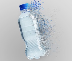 Bottle of water vanishing on light background. Decomposition of plastic pollution